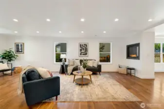The open layout allows for flexible use of space—easily accommodating two separate living or lounging areas, perfect for gatherings or everyday family living.