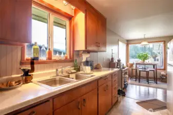 The kitchen opens up to the eating area.