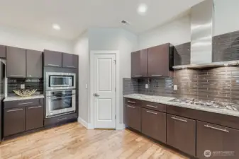 Loads of cabinet space with large walk-in pantry