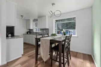 Dining opens to living room and kitchen. All new light fixtures.