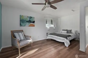 Primary bedroom with ceiling fan.