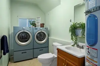 Laundry room with half bath.