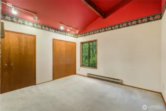 This primary bedroom has  two separate closet spaces.