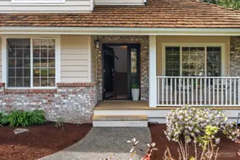 Front of house with covered front porch.