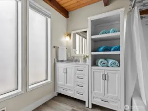 Here is a Peak into the Full Bathroom off of the Mudroom (East Entrance) on the Main Level.