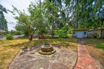 Spacious yard has multiple outdoor living areas.