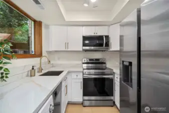 A full second kitchen on the lower level provides added convenience for multi-generational living, long-term guests, or potential rental use