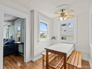 The dining nook with windows on all 3 sides is light, bright and airy. A nice sized table fits well here.