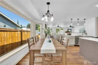 Extra large windows grace the kitchen eat in nook