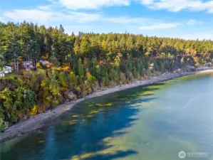 Expansive view of the sandy shoreline and scenic Saratoga Passage, showcasing Whidbey Island’s eastern-facing coast.