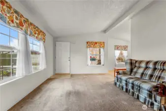 A view of the living room looking back toward the front door.