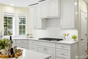 Beautiful white cabinetry, updated finishes, stainless appliances, and generous prep space in this move-in ready Maple Valley luxury home.