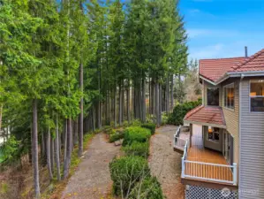 Private side yard surrounded by tall evergreens offering peaceful Northwest living just minutes from Lake Wilderness Park and Cedar River Trail.
