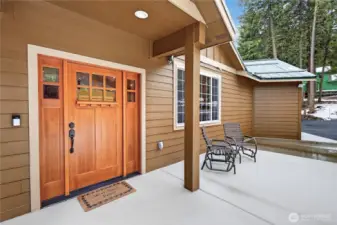 Heated concrete pad leading to the front door with Ring camera included.