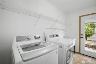 Laundry area with washer and dryer included on main level.