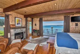 Beach house upper bedroom with nana doors.