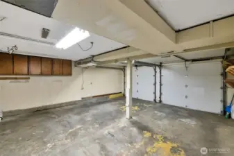 1 two car garage attached, 1 drive-thru one car garage attached, 1 one car garage in back yard