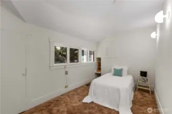 The smaller of the two main floor bedrooms, this room can accommodate a queen sized bed (the bed in the photo is a twin)