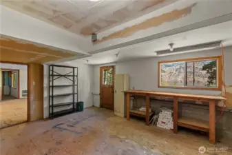 This room has been used as a workshop, with yet another exterior door for easy access.  Wouldn't this be a perfect space to become inspired by nature's beauty and create art in whatever medium suits you?