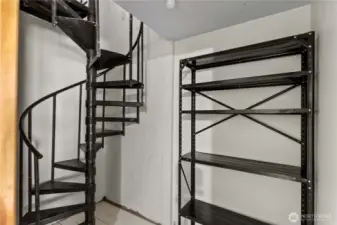 Here's a surprise! A secret spiral stairway leading to the kitchen. Made it easy to access all of the homemade preserves, fruits & veggies stored in the cool storage space in this little room (which also has a door to the outside).