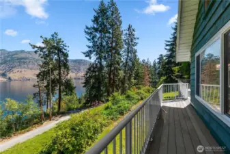 The deck runs the full length of the Lake Chelan view side of the home.