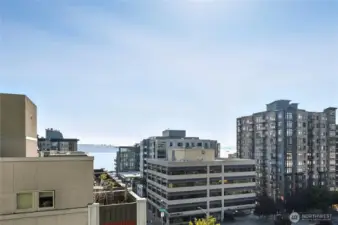 Sound & sunset views from your beautifully updated NW 2BR+Den corner home.