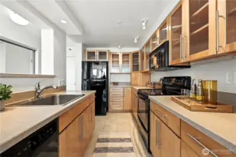 This kitchen has so much cabinet & drawer storage & an appliance garage in the corner to keep the countertops neat & tidy!