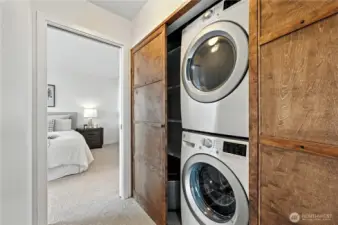 Laundry off the hallway with cool wood slider doors for a sophisticated & classy look!
