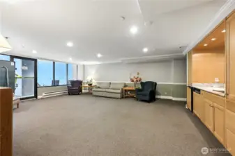 Party/Community room with flat screen TV, table tennis table & kitchenette.