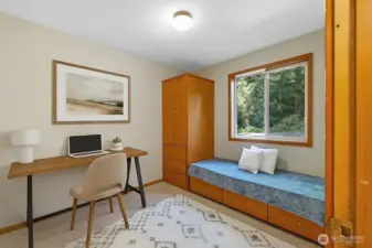 The main floor offers easy living with a versatile bedroom.