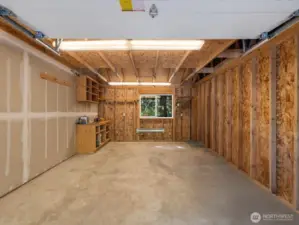 A 220 outlet in the garage and a generator hook-up ensure you stay connected and comfortable, even in the quiet seclusion of the forest.