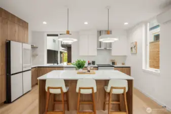 Warm wood tones and sleek white finishes create a perfect balance of modern and cozy.