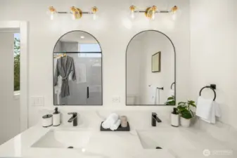 Modern simplicity meets quiet luxury in this spa-inspired bath with double vanities and soft, natural hues.