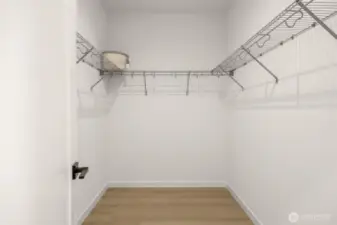 An organized dream space with room for all seasons, beautifully lit and perfectly placed just off the primary suite.