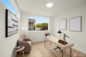 A quiet corner for creativity and focus, perfectly sized for a home office or art studio with a view.