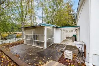 Backyard with shop and storage.