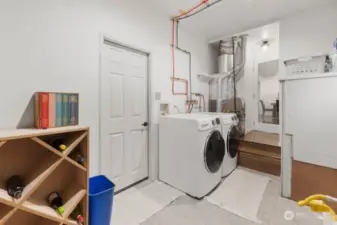 Oversize utility room with extra storage/pantry. Newer hot water heater installed in 2023.