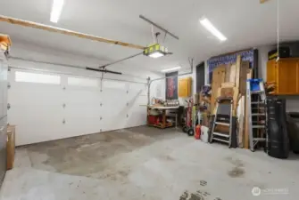 Large 2-car garage with storage space and utility sink. Additional uncovered parking space for up to 7 vehicles.