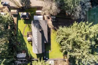 Room to Relax & Grow – This shy half-acre offers mature landscaping, towering trees, and open space ideal for gardening or simply enjoying the peaceful surroundings.