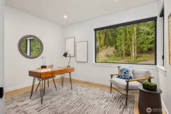 This is one of two offices/flex rooms. This main floor space is adjacent to a 3/4 bathroom so it can double as guest quarters.