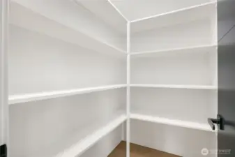 Upstairs walk-in linen closet.