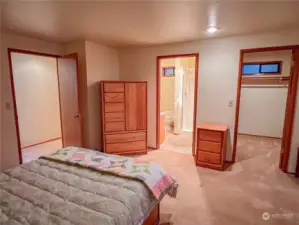 Primary bedroom with walk-in closet and 3/4 bath.