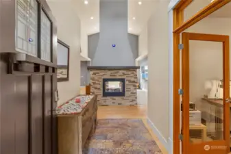 Dramatic entry with soaring vaulted ceilings and see thru fireplace.