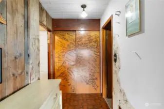 Hallway with closet door signed by islanders in the 1950s