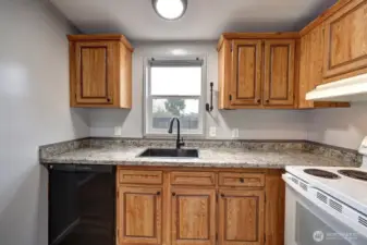 Kitchen with a view of the fully fenced back yard.