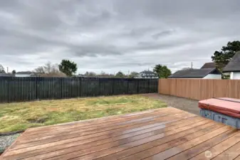 Fully fenced back yard with lots of hard scape and decretive pavers. Plus the hot tube for unwinding.