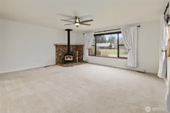 Primary bedroom is so spacious and offers a wood stove for cozy nights!