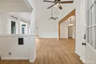 The nook off to the left could be a great home office or coffee bar!