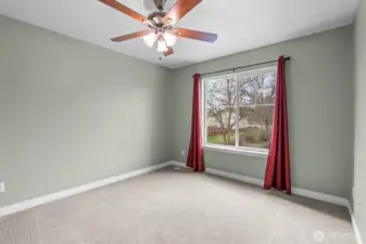 A bright and comfortable third bedroom overlooking the greenbelt