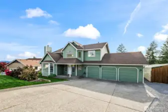 Expansive driveway, 3 car garage, RV parking & additional storage